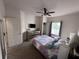 Bedroom with flat screen TV, ceiling fan, closet, and queen size bed at 5364 Diplomat Ct # 106, Kissimmee, FL 34746