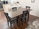A dining table with four chairs, suitable for Gathering meals at 5364 Diplomat Ct # 106, Kissimmee, FL 34746