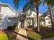 Well-maintained townhome with a cozy entrance and mature landscaping at 5364 Diplomat Ct # 106, Kissimmee, FL 34746