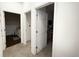 Bright hallway with doors leading to a bedroom and bathroom space at 5364 Diplomat Ct # 106, Kissimmee, FL 34746
