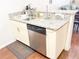 A well-designed kitchen area with modern appliances and a granite countertop at 5364 Diplomat Ct # 106, Kissimmee, FL 34746