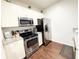 A modern kitchen featuring stainless steel appliances and granite countertops at 5364 Diplomat Ct # 106, Kissimmee, FL 34746