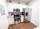 Modern kitchen featuring stainless steel appliances and granite countertops at 5364 Diplomat Ct # 106, Kissimmee, FL 34746