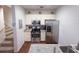 Bright kitchen featuring stainless steel appliances, granite countertops, and ample cabinet space at 5364 Diplomat Ct # 106, Kissimmee, FL 34746