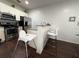 An open kitchen with stainless steel appliances and a breakfast bar at 5364 Diplomat Ct # 106, Kissimmee, FL 34746