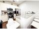 An open kitchen with stainless steel appliances and white cabinets at 5364 Diplomat Ct # 106, Kissimmee, FL 34746
