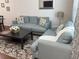 Cozy living room with comfortable seating, stylish rug, and contemporary decor at 5364 Diplomat Ct # 106, Kissimmee, FL 34746