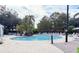 Resort-style pool area with plenty of seating and lush greenery, perfect for relaxation at 5364 Diplomat Ct # 106, Kissimmee, FL 34746