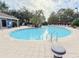 Inviting pool area with ample lounge chairs and lush landscaping, perfect for relaxation at 5364 Diplomat Ct # 106, Kissimmee, FL 34746