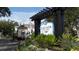 Community entrance sign with lush landscaping at Lucaya Village at 5364 Diplomat Ct # 106, Kissimmee, FL 34746