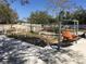 Inviting backyard with garden beds, lush greenery, and a comfortable swing at 539 Libby Rd, Babson Park, FL 33827
