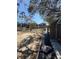 A wide angle exterior shot of the backyard and surrounding buildings at 539 Libby Rd, Babson Park, FL 33827