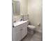 Well-maintained bathroom with a classic white vanity and toilet, providing a clean and functional space at 539 Libby Rd, Babson Park, FL 33827