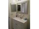 Bright bathroom with a vanity, sink, and mirror providing essential amenities at 539 Libby Rd, Babson Park, FL 33827