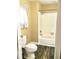 Bathroom with a combination shower and tub, a wood-look floor, and a toilet at 539 Libby Rd, Babson Park, FL 33827