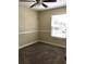 Cozy bedroom with neutral walls, carpet floors, and a ceiling fan providing a comfortable space at 539 Libby Rd, Babson Park, FL 33827
