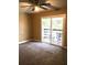 Bedroom with a sliding glass door that leads to a balcony, neutral paint, and a ceiling fan at 539 Libby Rd, Babson Park, FL 33827
