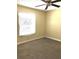 Bedroom with neutral carpet, natural lighting, a window, and a ceiling fan at 539 Libby Rd, Babson Park, FL 33827