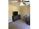 Carpeted bedroom featuring ceiling fan, dresser, and lots of room to relax at 539 Libby Rd, Babson Park, FL 33827