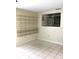 Bright room featuring tile flooring, built-in shelving, and a window at 539 Libby Rd, Babson Park, FL 33827