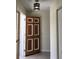 Entryway with a paneled door and decorative light fixture at 539 Libby Rd, Babson Park, FL 33827