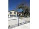 Two-story house with a well-manicured front yard, complete with a secure gate at 539 Libby Rd, Babson Park, FL 33827