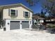 Charming two-story home with a well-maintained exterior, attached garage, and beautiful flower boxes at 539 Libby Rd, Babson Park, FL 33827