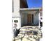 Inviting front entrance with a unique door, flowers, and decorative elements creating a warm and welcoming appeal at 539 Libby Rd, Babson Park, FL 33827