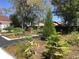 Lush front yard featuring landscaping, trees, and garden beds that create a serene outdoor space at 539 Libby Rd, Babson Park, FL 33827