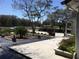 Well-maintained front yard with dark mulch beds contrasts with the light concrete driveway at 539 Libby Rd, Babson Park, FL 33827