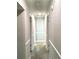 Hallway with gray paint, white trim, neutral carpet and overhead lighting at 539 Libby Rd, Babson Park, FL 33827