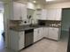 A well-lit kitchen boasts stainless steel appliances and granite countertops, perfect for modern cooking at 539 Libby Rd, Babson Park, FL 33827