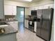 Kitchen featuring granite countertops, stainless steel appliances and tile flooring at 539 Libby Rd, Babson Park, FL 33827