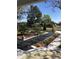 Landscaped yard features garden beds bordered by white concrete and black weed control matting at 539 Libby Rd, Babson Park, FL 33827