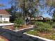 Lush garden landscape design with mulch, greenery, and black weed control matting at 539 Libby Rd, Babson Park, FL 33827