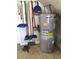 Image of an AO Smith water heater with assorted cleaning supplies at 539 Libby Rd, Babson Park, FL 33827