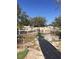 A backyard is being converted into a garden space, enclosed by a white picket fence at 539 Libby Rd, Babson Park, FL 33827