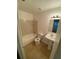 Bathroom with a single sink vanity, tiled flooring, and a tub shower combo at 5968 Westgate Dr # 101, Orlando, FL 32835