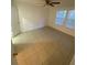 Bright bedroom featuring tiled floor, a ceiling fan, and natural light from the windows at 5968 Westgate Dr # 101, Orlando, FL 32835