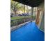 Screened in patio with blue flooring at 5968 Westgate Dr # 101, Orlando, FL 32835