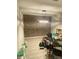 Room with brick accent wall and modern lighting at 5968 Westgate Dr # 101, Orlando, FL 32835