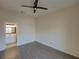 Bedroom features a ceiling fan and an attached bathroom with a vanity and large mirror at 709 Lucaya Loop # 1203, Davenport, FL 33897