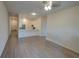 Bright living room featuring hardwood floors and an open concept to the kitchen at 709 Lucaya Loop # 1203, Davenport, FL 33897
