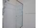 Modern bathroom shower stall with a glass door, white tile, and chrome fixtures at 709 Lucaya Loop # 1203, Davenport, FL 33897