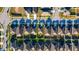 A bird's-eye view of a well-maintained neighborhood with neatly arranged homes, lawns, and streets at 751 Jefferson St, Davenport, FL 33837