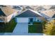 An aerial view showcases the home's roof, landscaping, and driveway within a suburban community at 751 Jefferson St, Davenport, FL 33837