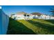 View of a spacious backyard with green grass and a full privacy fence at 751 Jefferson St, Davenport, FL 33837