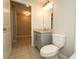 Bathroom featuring a granite countertop, sleek faucet, and modern fixtures at 751 Jefferson St, Davenport, FL 33837