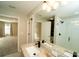 Bathroom featuring a dual granite countertop, sleek faucets, and glass shower at 751 Jefferson St, Davenport, FL 33837