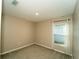 Neutral bedroom with plush carpet and natural light from a window at 751 Jefferson St, Davenport, FL 33837